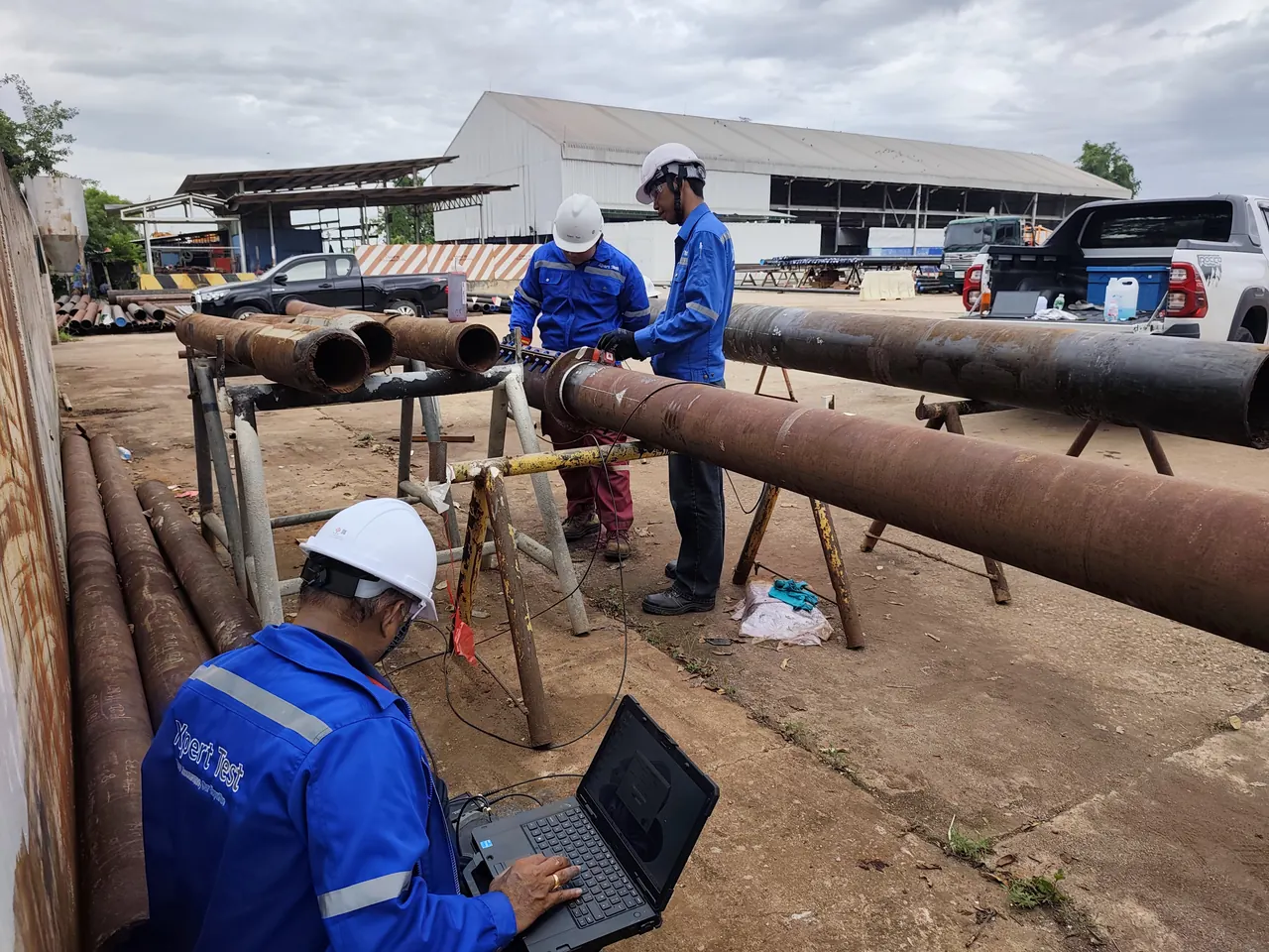 Expert Test crew performing HOMC Guided-Wave ultrasonic inspection on piping during a field demonstration